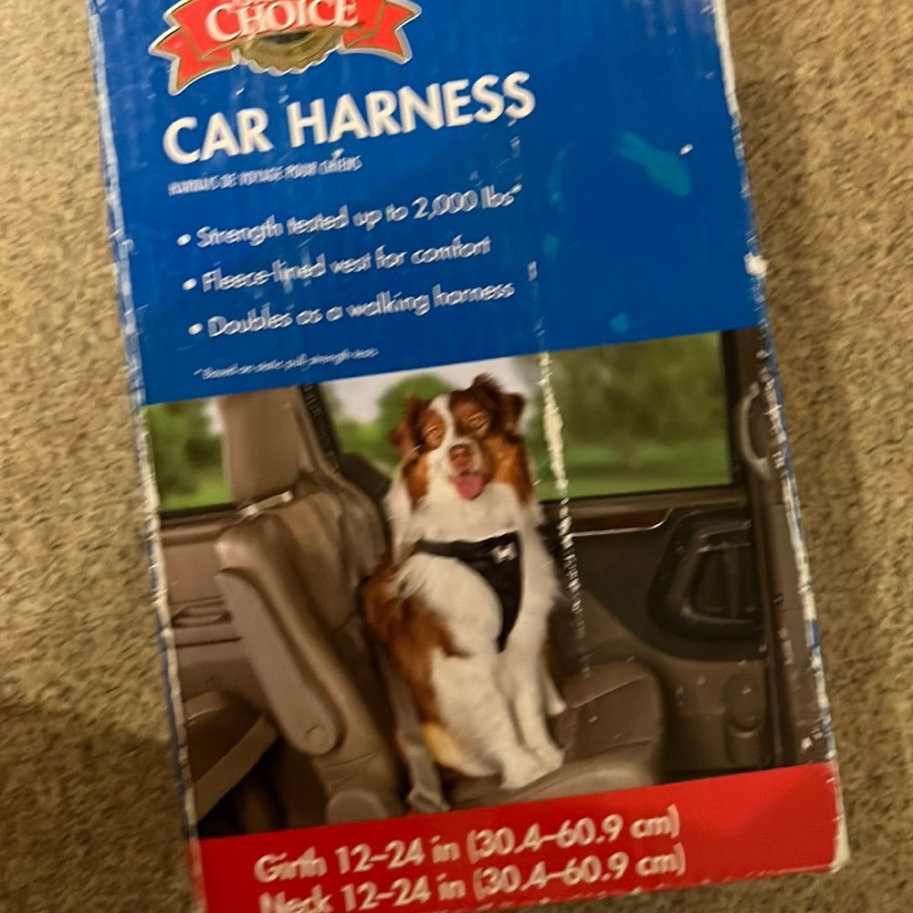 DOG CAR HARNESS 20-55 POUNDS NEVER BEEN USED  JUST BEEN OPENED. DIRECTIONS